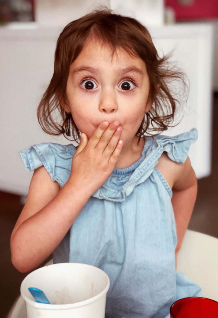 child with shocked look on her face